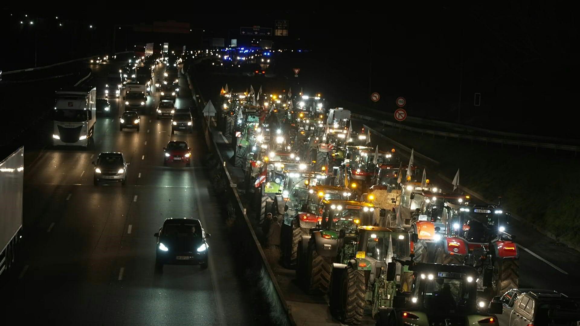 France : protesting farmers block a highway with tractors near wholesale food market