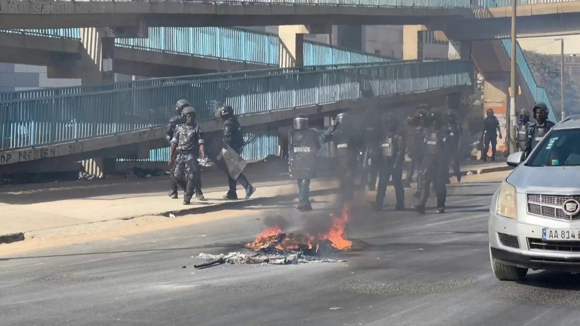 Protesters build barricades in Dakar as clashes follow Senegal election postponement