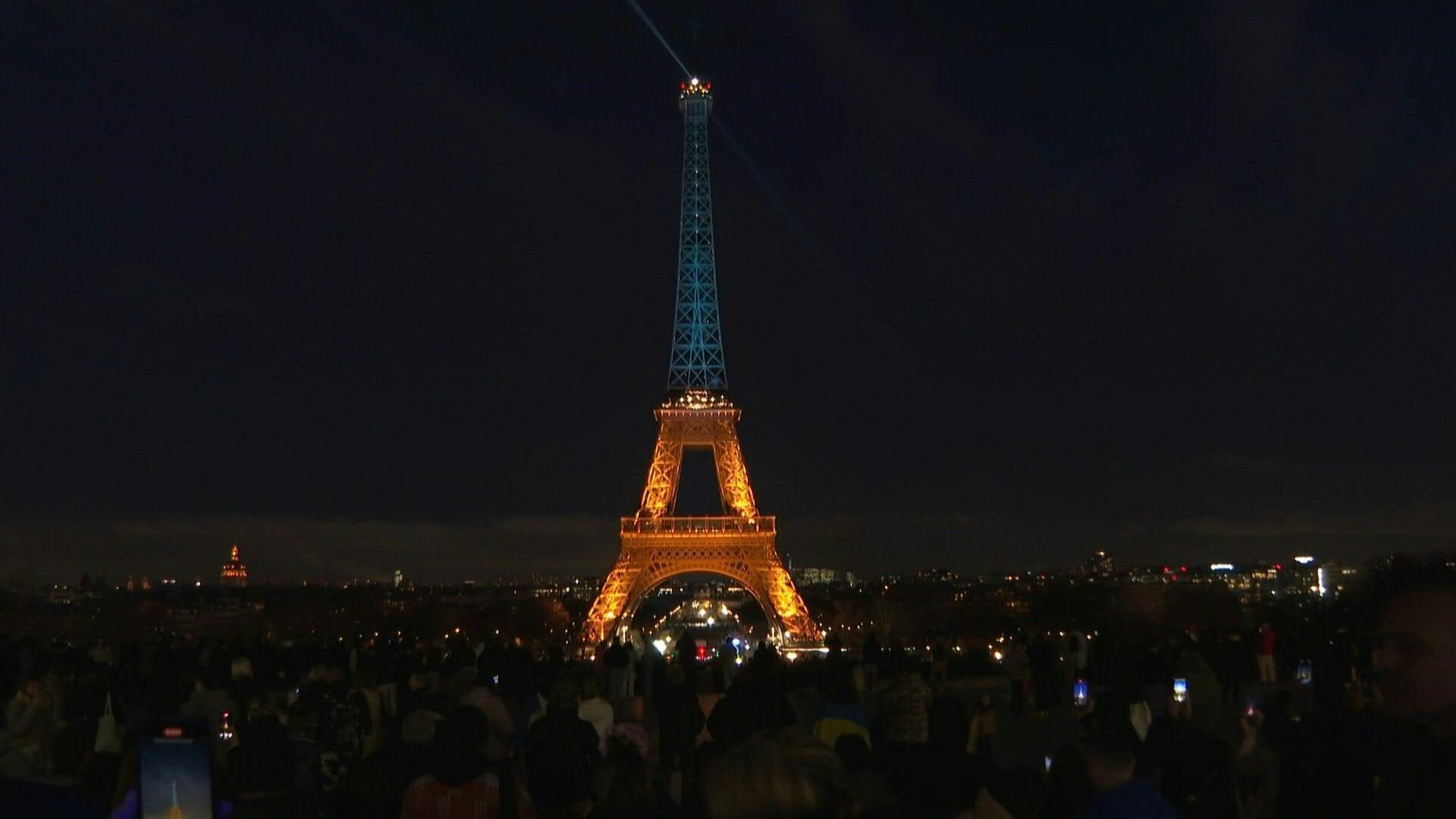 Eiffel Tower lit up in the colours of the Ukrainian flag