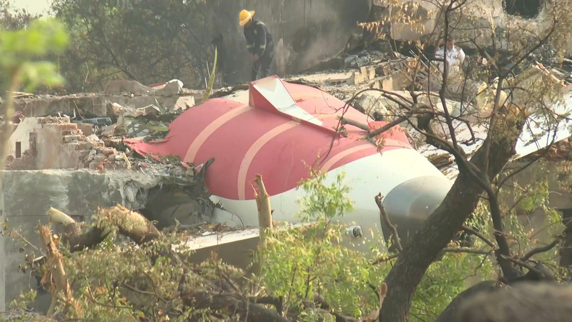 Plane wreckage at site of Air India crash that killed at least 265