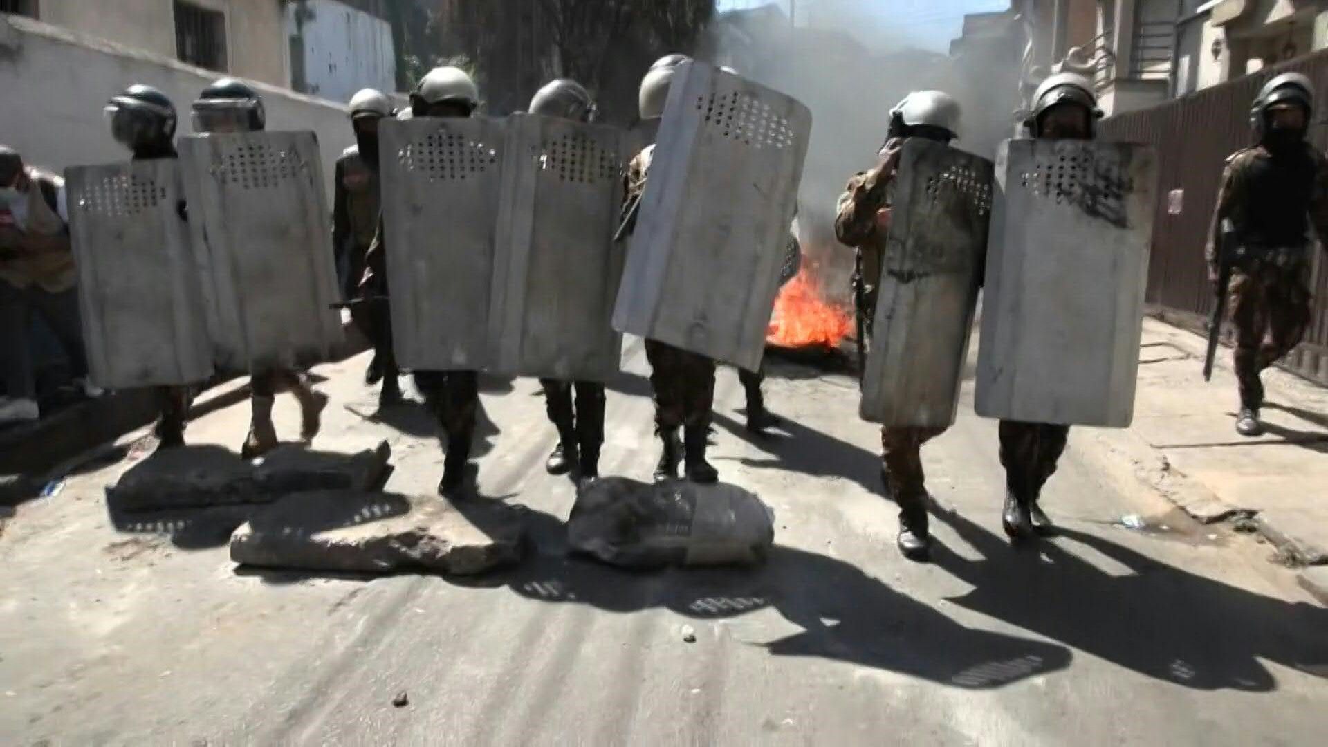 Riot police and protestors clash in the Madagascar capital