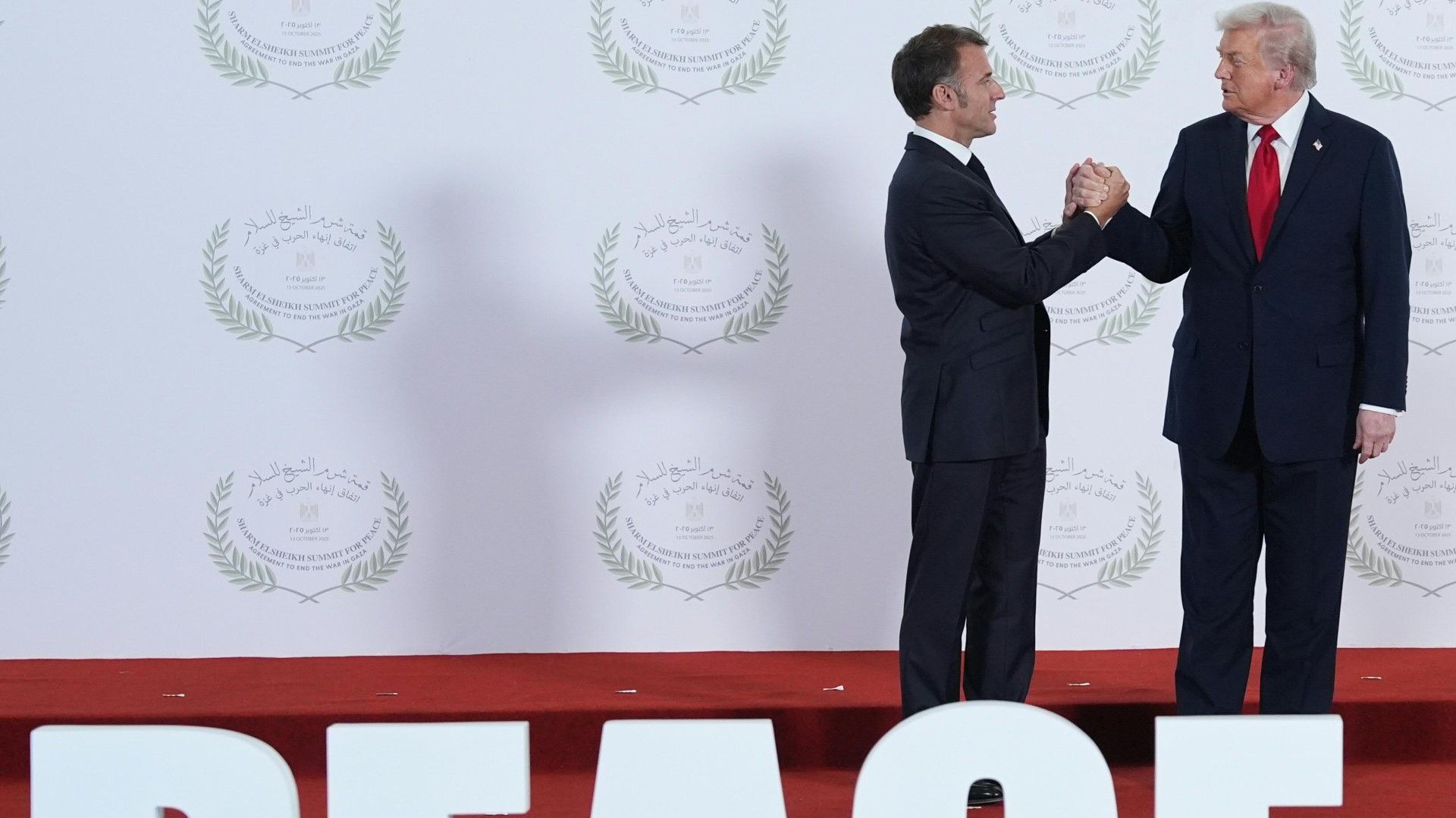 Bizarre 30-Second Handshake between Trump and Macron