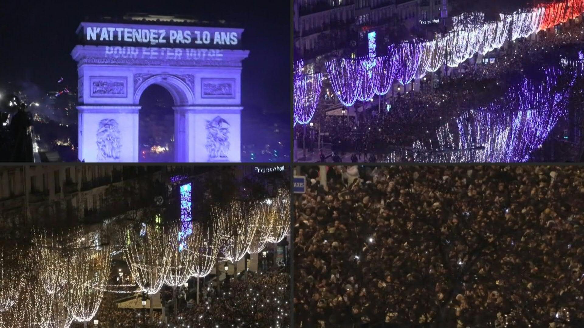Video: Crowd gathers on the Champs Elysées to watch New Year's Eve fireworks