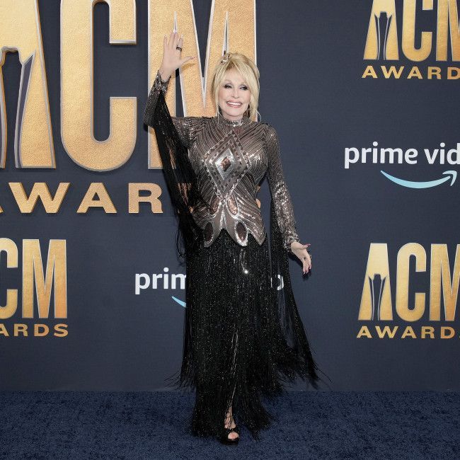 Dolly Parton thinks late husband Carl Dean would want her to keep going after his death