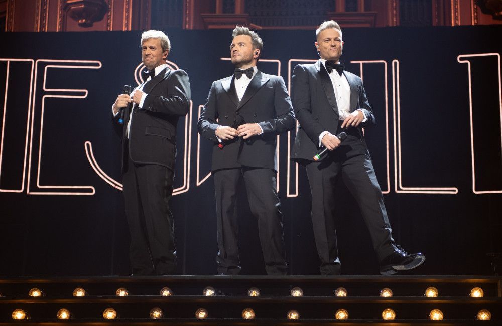 'We love him, we miss him...' Westlife pay tribute to missing member Mark Feehily at 25th anniversary concert in London