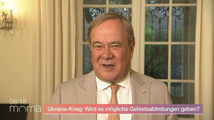After ZDF journalist's throw-in, Laschet strikes a different tone: 