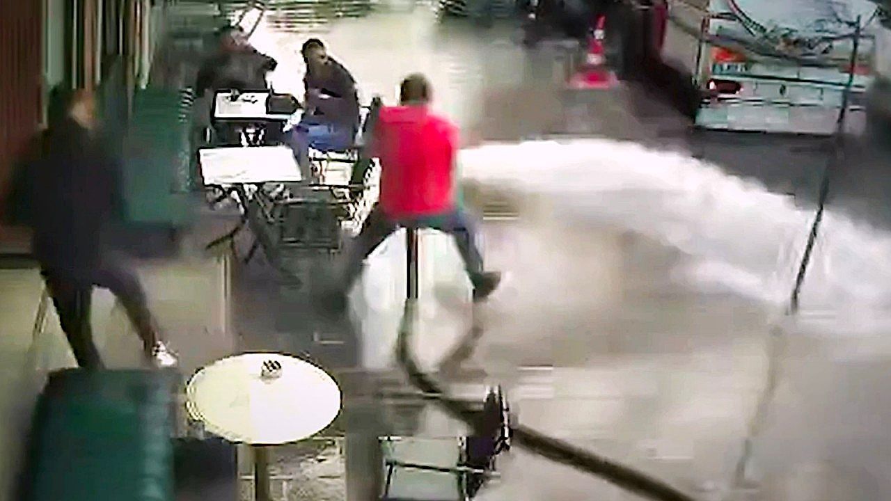 Cafe owner accidentally sprays customers with high-pressure hose