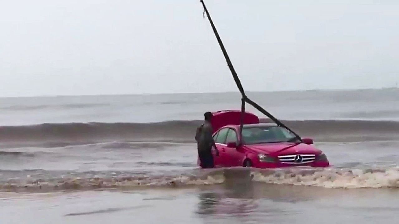 Epic stunt fail! Teen gets Mercedes stuck in the sea in India