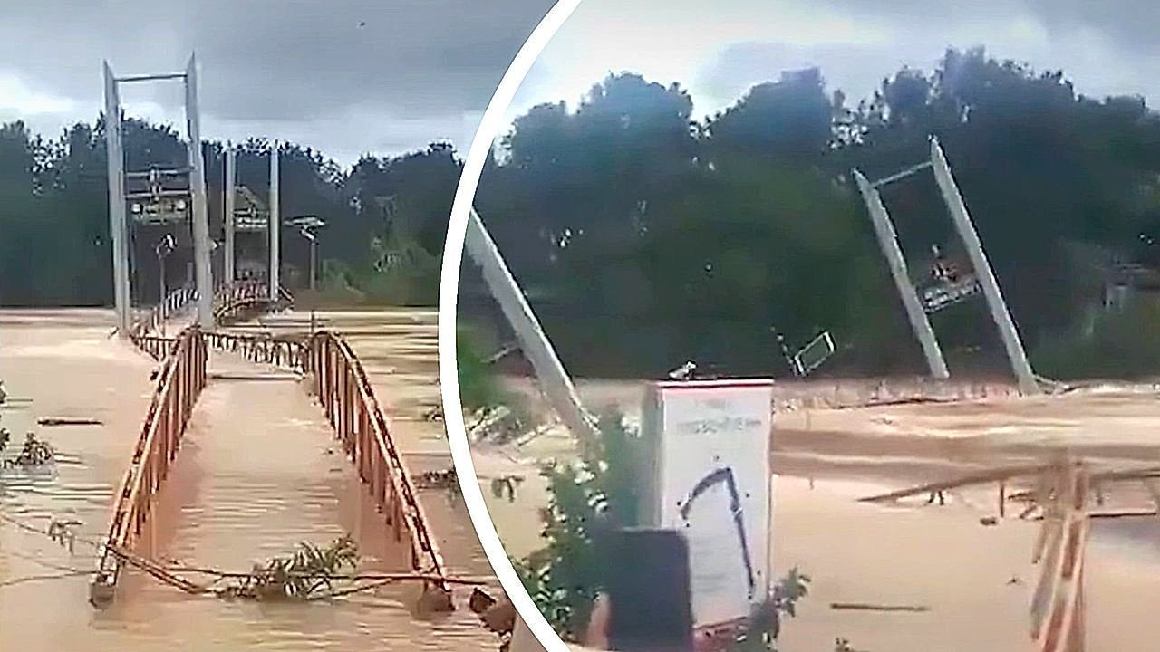 Video: Swallowed by nature: Raging floodwaters sweep away suspension bridge