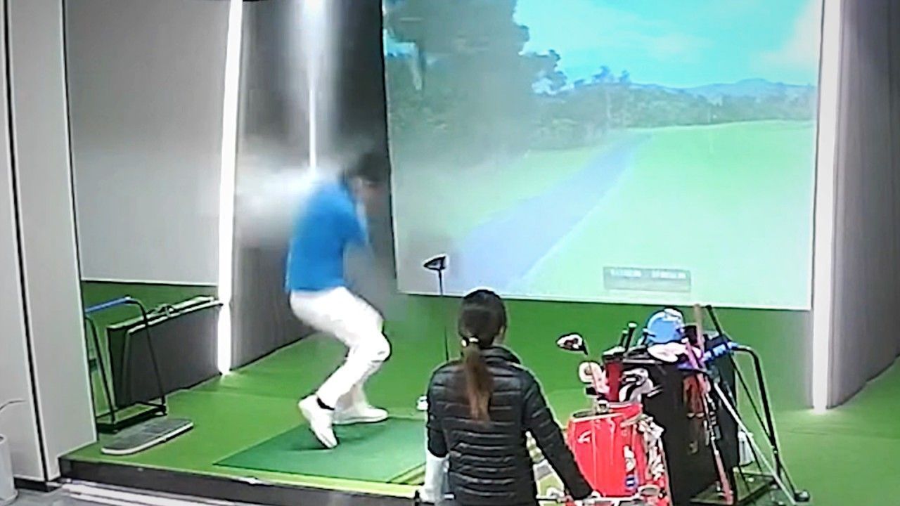Video: CCTV: Golfer hits the ceiling of indoor simulator causing sprinkler to burst open