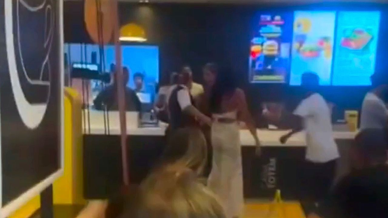 Customer launches flying kick at McDonald's worker as burgers fly in mass punch up