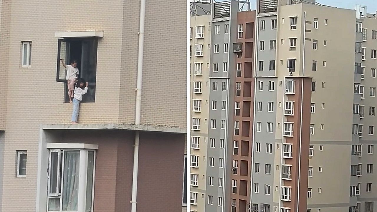 Video: Schwindelerregende Höhe: Mädchen balancieren auf schmalem Sims an Hochhaus in China