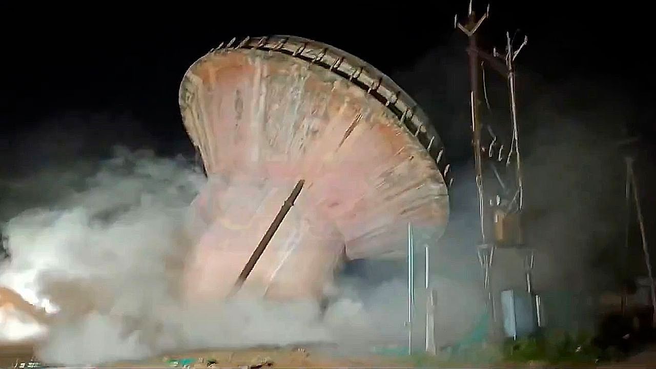 Video: 40-year-old water tank dramatically collapses during night demolition in India