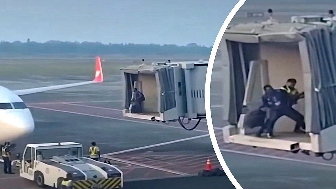 Video: Late passenger for his flight fights with security at the boarding bridge