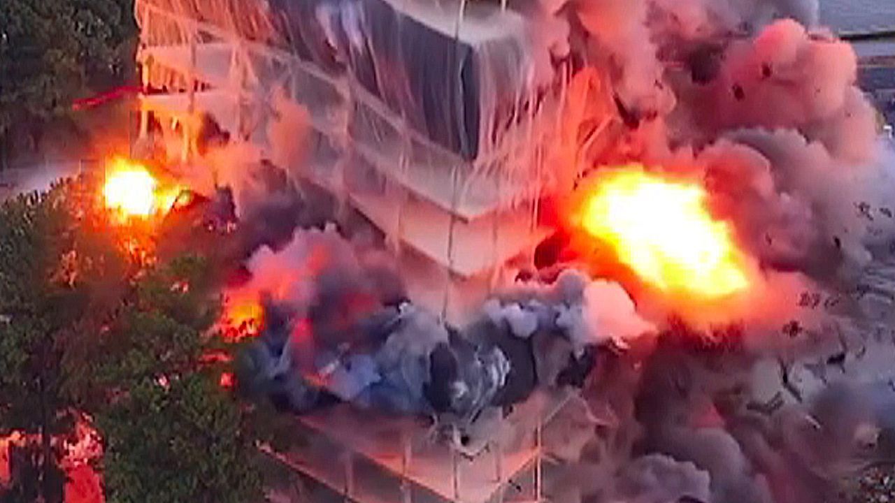 Old Georgia Department of Revenue building collapses in controlled demolition