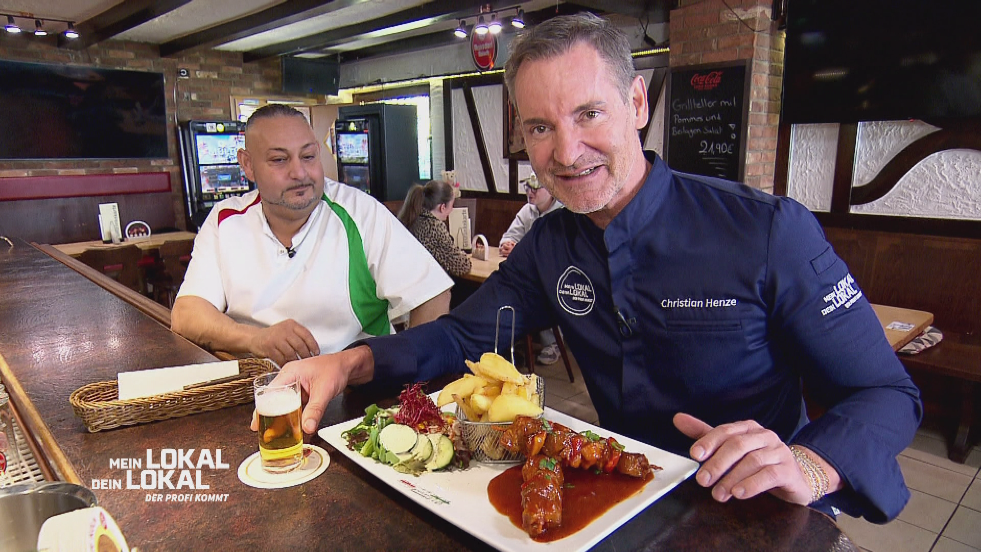 Christian Henze tries traditional shashlik at the 